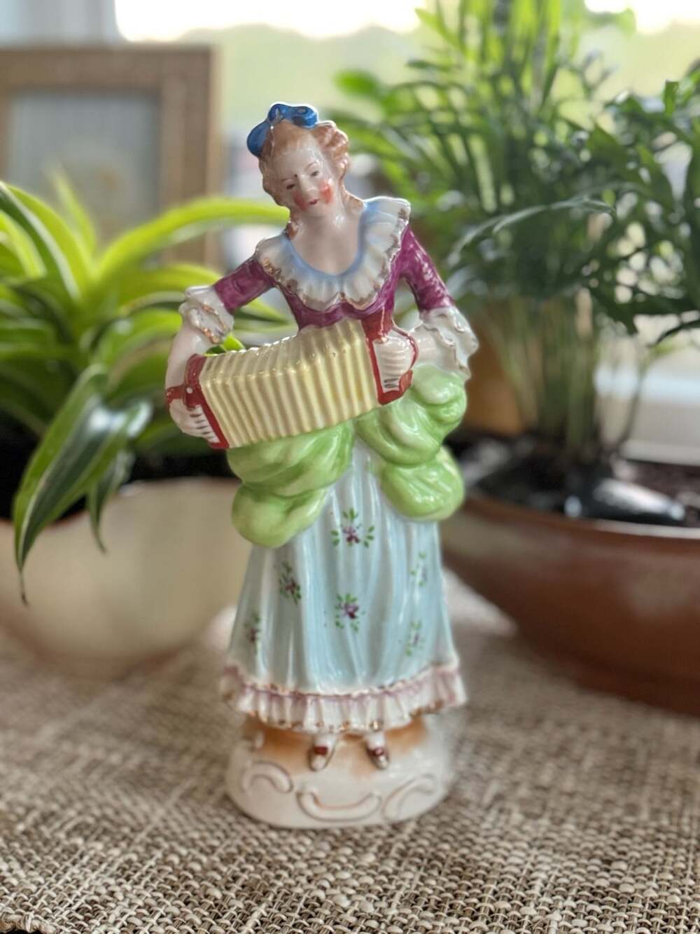 Vintage Porcelain Figurine of a Woman Playing an Accordion, Occupied Japan